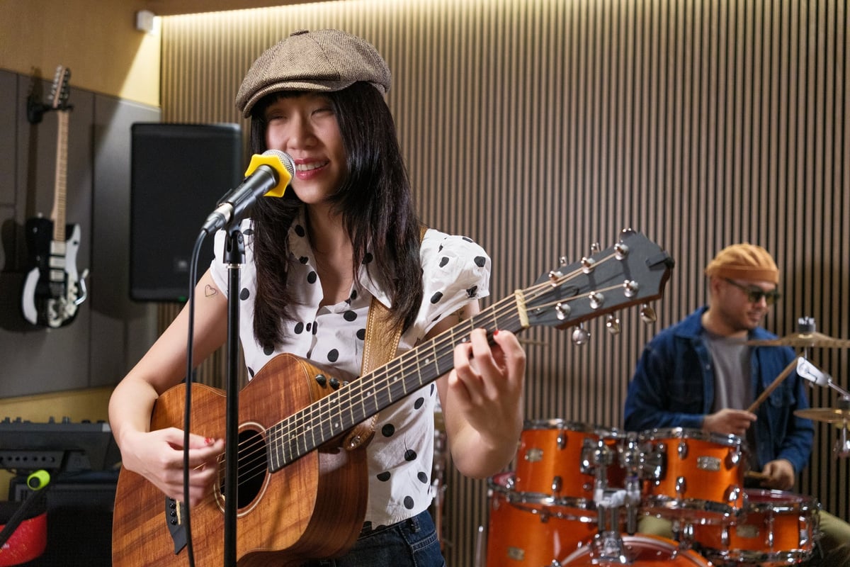 Musicians creating together during golden hour with vintage concert energy